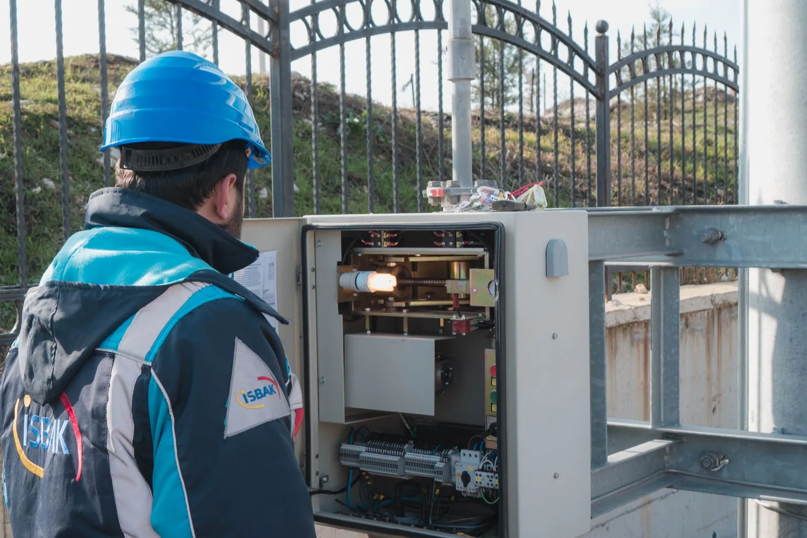 Electrician testing a domestic consumer unit with a meter